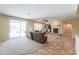 Bright living room featuring a fireplace, ceiling fan, and access to a backyard patio at 2514 E Grand Canyon Dr, Chandler, AZ 85249