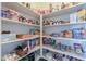 Fully stocked pantry with organized shelving for ample storage at 2514 E Grand Canyon Dr, Chandler, AZ 85249