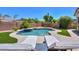 Inviting backyard pool with lounge chairs and patio area for relaxing at 2514 E Grand Canyon Dr, Chandler, AZ 85249