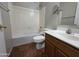 A bathroom boasting a combined shower-tub, vanity with sink, mirror, and tile flooring at 25748 W Siesta Way, Buckeye, AZ 85326