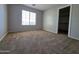 Sunlit bedroom featuring a window and closet access, offering a serene and functional living space at 25748 W Siesta Way, Buckeye, AZ 85326