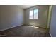 A bright carpeted bedroom with natural light at 25748 W Siesta Way, Buckeye, AZ 85326