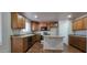 Well-appointed kitchen featuring custom cabinets, stainless steel appliances, and center island at 25748 W Siesta Way, Buckeye, AZ 85326