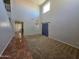 Bright, open living room with high ceilings and abundant natural light at 25748 W Siesta Way, Buckeye, AZ 85326