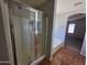 Modern bathroom shower with glass door and tile walls, a sleek design for a comfortable showering experience at 25748 W Siesta Way, Buckeye, AZ 85326