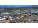 Panoramic aerial view of neighborhood with a complex, showcasing landscaping, parking, and mountain views at 2625 E Indian School Rd # 206, Phoenix, AZ 85016