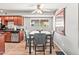 Dining room with wood floors, gray walls, and a window to bring in natural light at 2625 E Indian School Rd # 206, Phoenix, AZ 85016
