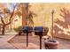 Community outdoor gas grills for resident use in the landscaped backyard at 2625 E Indian School Rd # 206, Phoenix, AZ 85016