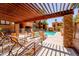 Inviting community pool with lounge chairs and shaded pergola, perfect for relaxation on sunny days at 2625 E Indian School Rd # 206, Phoenix, AZ 85016