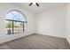 Empty bedroom featuring a large window and neutral carpeting at 2716 N Kristen --, Mesa, AZ 85213