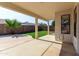 Relaxing covered patio with views of the fenced backyard and landscaping at 2716 N Kristen --, Mesa, AZ 85213