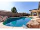 Backyard swimming pool features unique rock features at 2716 N Kristen --, Mesa, AZ 85213