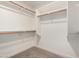 Spacious walk-in closet features wood rods and neutral carpet at 2716 N Kristen --, Mesa, AZ 85213