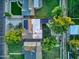 Aerial view of the home showcasing a solar panel roof, backyard, and mature trees at 3018 E Mulberry Dr, Phoenix, AZ 85016