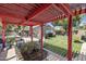 Inviting backyard with covered patio, lush lawn, shed with mural, and outdoor seating area at 3018 E Mulberry Dr, Phoenix, AZ 85016