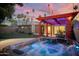 Stunning backyard featuring a spa, pergola, and ample space for outdoor living at 3018 E Mulberry Dr, Phoenix, AZ 85016