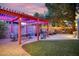 Expansive backyard with seating areas, grill, spa, pergola, and lush green lawn at 3018 E Mulberry Dr, Phoenix, AZ 85016