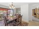 Dining room featuring an elegant wood table, chandelier, and access to the outdoor patio at 3018 E Mulberry Dr, Phoenix, AZ 85016