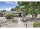 Charming front yard with lush landscaping, decorative rock features, and a welcoming walkway to the entrance at 3018 E Mulberry Dr, Phoenix, AZ 85016