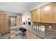 Spacious kitchen with stainless steel appliances, a breakfast bar, and ample cabinet space at 3018 E Mulberry Dr, Phoenix, AZ 85016