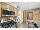 Modern kitchen with stainless appliances, granite counters, and bright lighting at 3018 E Mulberry Dr, Phoenix, AZ 85016