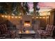 Inviting outdoor fireplace with comfortable seating, creating a warm and cozy ambiance at 3018 E Mulberry Dr, Phoenix, AZ 85016