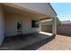 Covered patio with gravel landscaping, ideal for outdoor relaxation and entertaining in a private setting at 30938 W Mitchell Dr, Buckeye, AZ 85396