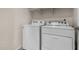 Efficient laundry area with a washer and dryer, providing convenience for everyday chores at 30938 W Mitchell Dr, Buckeye, AZ 85396