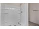 Clean and modern shower with built-in shelves and white fixtures at 30938 W Mitchell Dr, Buckeye, AZ 85396