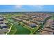 Aerial view of community featuring a pond and mountain views in the distance at 3131 S Mingus Dr, Chandler, AZ 85286