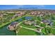 Aerial view of Layton Lakes community park featuring a splash pad, playground, lake, gazebo, and walking paths at 3131 S Mingus Dr, Chandler, AZ 85286
