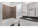 Elegant bathroom featuring granite counters, a bathtub, and a shower, blending style with functionality at 3131 S Mingus Dr, Chandler, AZ 85286