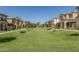 Beautifully landscaped community with lush green lawns, mature trees, and well-maintained homes, creating a welcoming and serene environment at 3131 S Mingus Dr, Chandler, AZ 85286