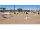 Well-equipped dog park with agility equipment, benches, and shade, perfect for pet owners at 3131 S Mingus Dr, Chandler, AZ 85286