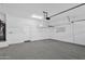 Clean, well-lit garage with ample storage space, water heater, and a door to the house at 3131 S Mingus Dr, Chandler, AZ 85286