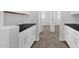Hallway with carpet floors, white walls and cabinets. The space features neutral colors and storage space at 3131 S Mingus Dr, Chandler, AZ 85286