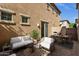 Relaxing outdoor patio with comfortable seating, dining area, grill, and privacy wall, perfect for entertaining at 3131 S Mingus Dr, Chandler, AZ 85286