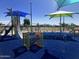 Modern playground features a slide, tunnel, and various colorful play structures with soft surfacing at 3131 S Mingus Dr, Chandler, AZ 85286