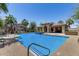 Community pool with tropical landscaping, lounge seating, and a spacious deck area at 3131 S Mingus Dr, Chandler, AZ 85286