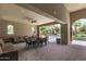 Inviting pool area with ample seating, ceiling fans, and shaded lounging spaces, perfect for relaxation and entertaining at 3131 S Mingus Dr, Chandler, AZ 85286
