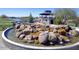 Beautiful community water feature with rock waterfall and gazebo overlooking lake at 3131 S Mingus Dr, Chandler, AZ 85286