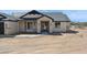 Gorgeous home featuring a stone-accented front entrance with a tiled roof and desert landscaping at 31652 N Misty Ln, Queen Creek, AZ 85142