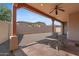 Covered patio with ceiling fan, offering a comfortable outdoor living space at 3215 E Constance Way, Phoenix, AZ 85042