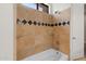 Well maintained bathroom with a tiled shower and a large tub for relaxation at 3215 E Constance Way, Phoenix, AZ 85042