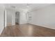 Large bedroom featuring hardwood floors, tray ceilings, and recessed lights at 3215 E Constance Way, Phoenix, AZ 85042
