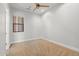 Neutral bedroom with a ceiling fan, carpeted floors, and natural light from the window at 3215 E Constance Way, Phoenix, AZ 85042
