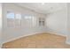 Bright bedroom with white walls, tile flooring, and windows with plantation shutters at 3215 E Constance Way, Phoenix, AZ 85042