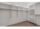 Walk-in closet with built-in shelving and hanging rods at 3215 E Constance Way, Phoenix, AZ 85042