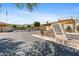 The community entrance features a stone sign, lush landscaping, and a gated entrance at 3215 E Constance Way, Phoenix, AZ 85042