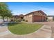 Beautiful home exterior featuring a well-manicured lawn and decorative stone accents at 3215 E Constance Way, Phoenix, AZ 85042